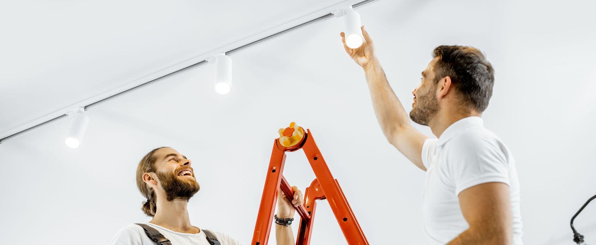 Two Repair Men Installing Lights